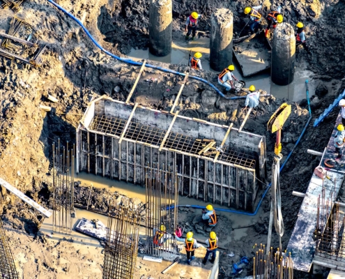 Image of workers building the foundation of a building.