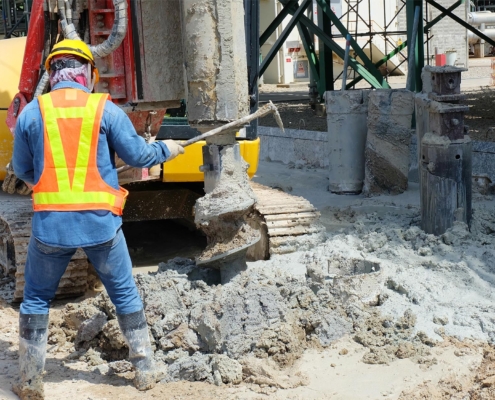 Hydraulic drilling machine is boring holes in the construction site for bored piles work.