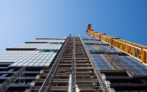 Worm's eye view of construction being done on a high rise building